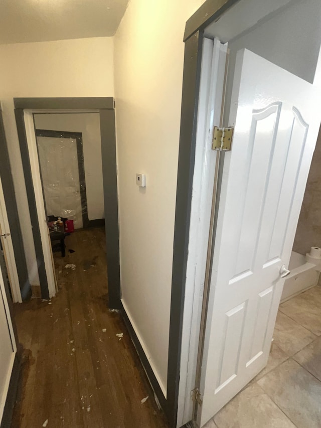 hallway with wood finished floors