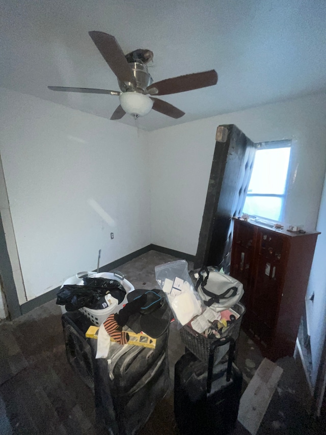 bedroom featuring ceiling fan and baseboards