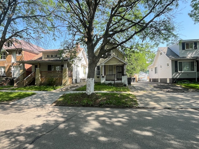 view of front of home with concrete driveway and covered porch