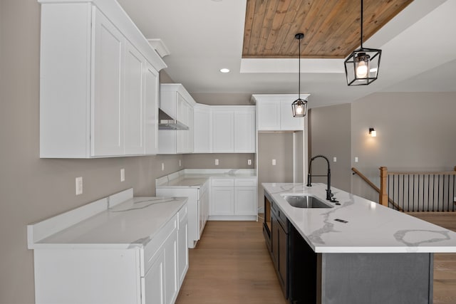 35873 Glenville Dr, New Baltimore, MI 48047 - kitchen with a sink, ventilation hood, light wood-style floors, recessed lighting, and light stone counters