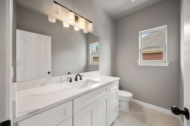 35873 Glenville Dr, New Baltimore, MI 48047 - bathroom featuring vanity, marble finish floor, baseboards, and toilet