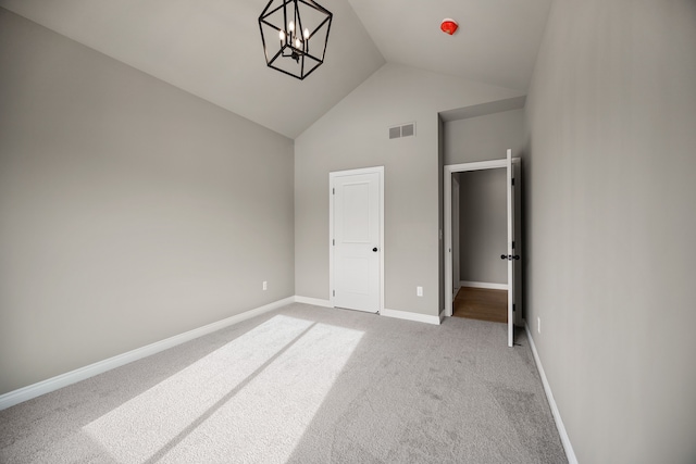 35873 Glenville Dr, New Baltimore, MI 48047 - unfurnished bedroom featuring baseboards, light carpet, a chandelier, visible vents, and high vaulted ceiling