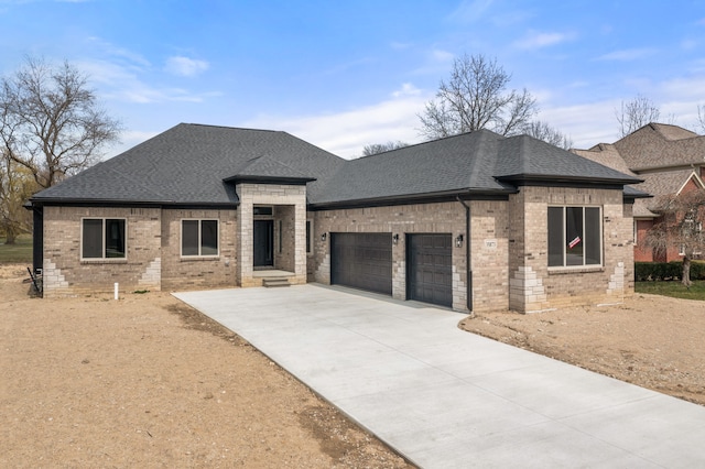35873 Glenville Dr, New Baltimore, MI 48047 - view of front of house with brick siding, an attached garage, a shingled roof, and driveway