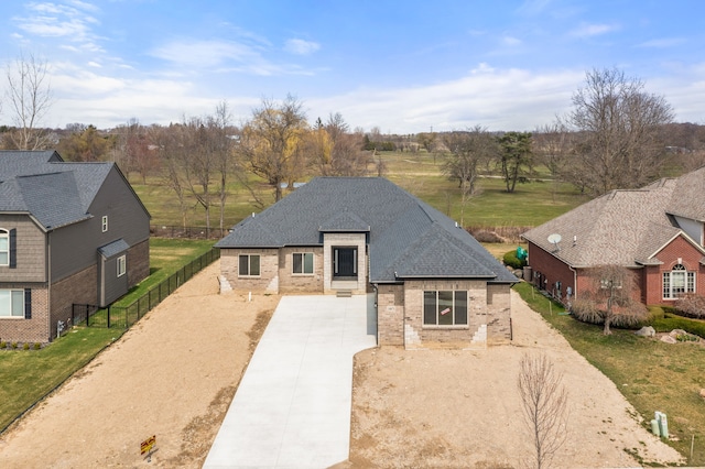 35873 Glenville Dr, New Baltimore, MI 48047 - view of front of home featuring roof with shingles, driveway, fence, and brick siding