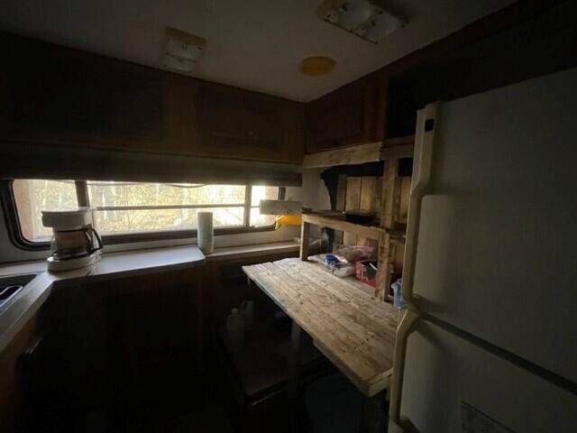 kitchen featuring plenty of natural light and white refrigerator