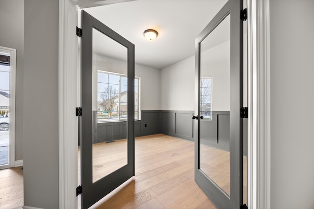 doorway with light hardwood / wood-style flooring