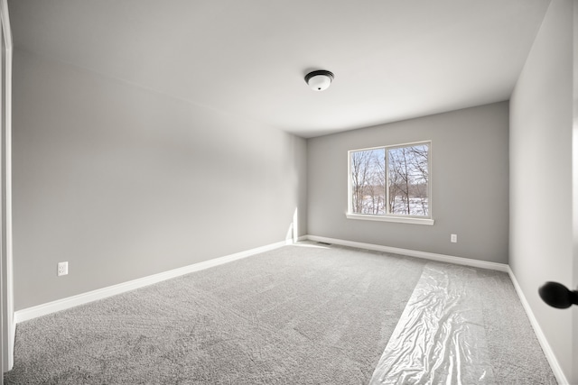 empty room featuring carpet flooring