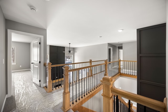 hallway with light colored carpet