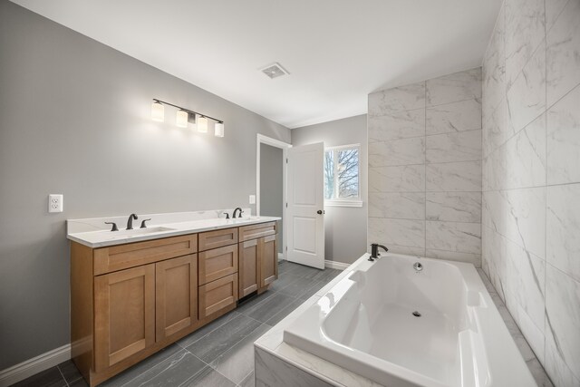 bathroom with vanity and a relaxing tiled tub