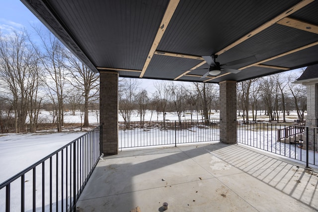 snow covered patio with ceiling fan