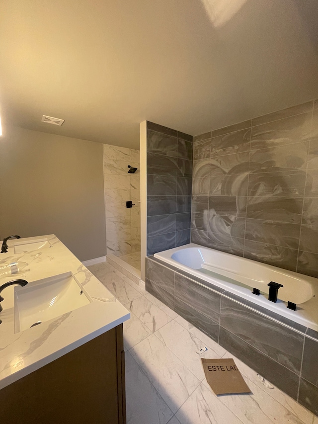 bathroom featuring separate shower and tub and vanity