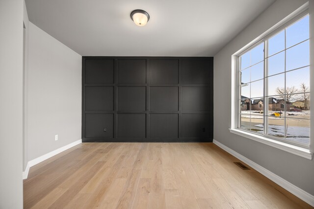 unfurnished room featuring light wood-type flooring