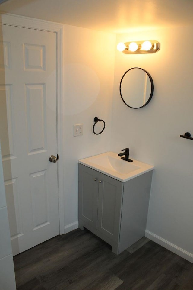 bathroom featuring hardwood / wood-style floors and vanity