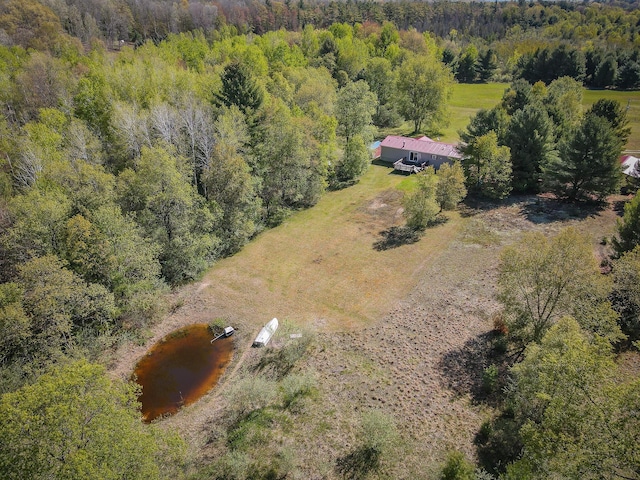 2314 Revolt Rd, Manistee, MI 49660 - overview of rural landscape featuring a heavily wooded area