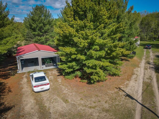 2314 Revolt Rd, Manistee, MI 49660 - view of subject property featuring a heavily wooded area