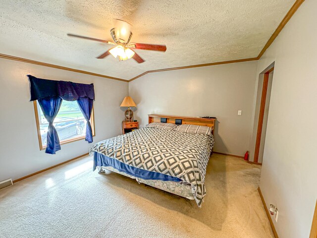 2314 Revolt Rd, Manistee, MI 49660 - carpeted bedroom with crown molding, a textured ceiling, a ceiling fan, and baseboards
