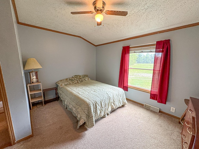 2314 Revolt Rd, Manistee, MI 49660 - carpeted bedroom with ornamental molding, a textured ceiling, a ceiling fan, and baseboards
