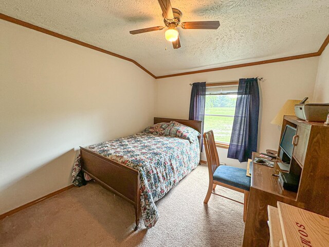 2314 Revolt Rd, Manistee, MI 49660 - carpeted bedroom featuring crown molding, a textured ceiling, a ceiling fan, baseboards, and vaulted ceiling