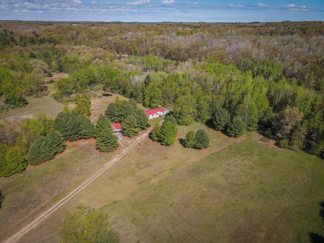 2314 Revolt Rd, Manistee, MI 49660 - aerial view of property and surrounding area featuring a heavily wooded area