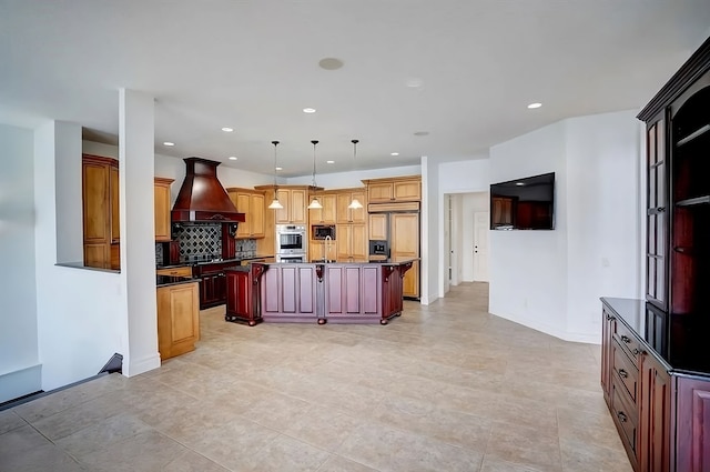 kitchen with backsplash, premium range hood, pendant lighting, built in appliances, and a center island