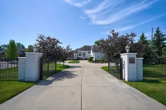 view of gate featuring a yard