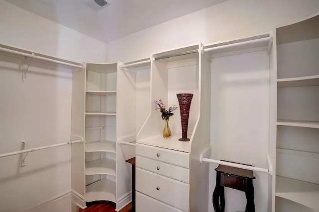 walk in closet featuring hardwood / wood-style floors