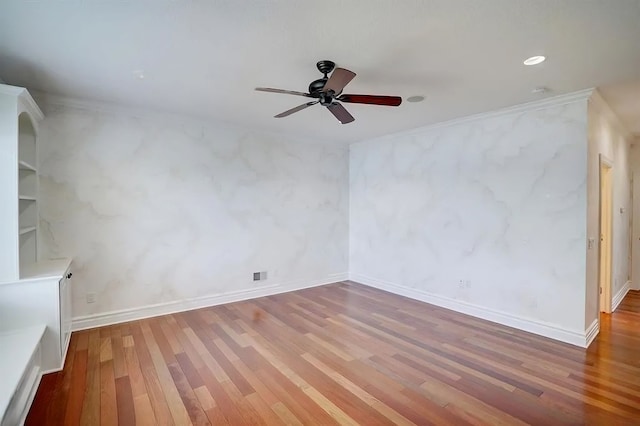 unfurnished living room with hardwood / wood-style floors, ceiling fan, and crown molding