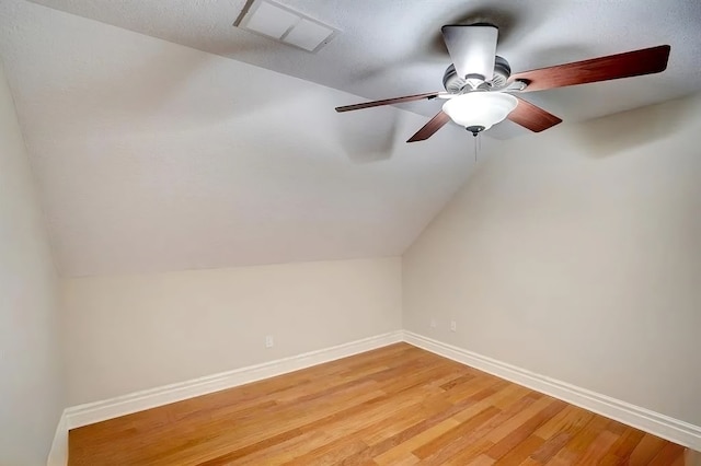 bonus room featuring hardwood / wood-style flooring, ceiling fan, and lofted ceiling