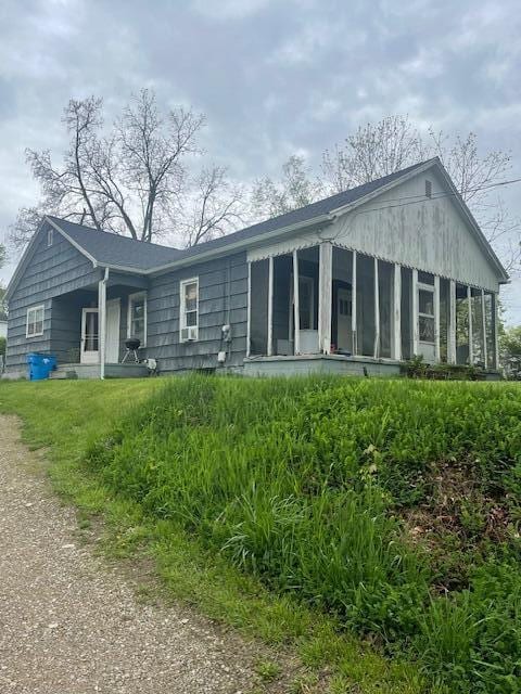 621 E Michigan Ave, Grass Lake, MI 49240 - back of house featuring a sunroom