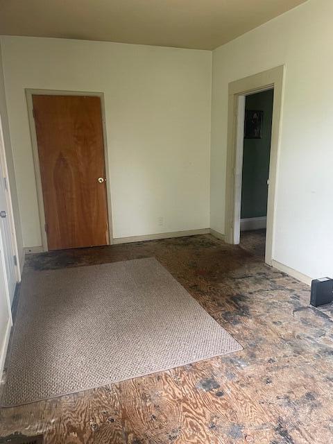 621 E Michigan Ave, Grass Lake, MI 49240 - spare room featuring baseboards