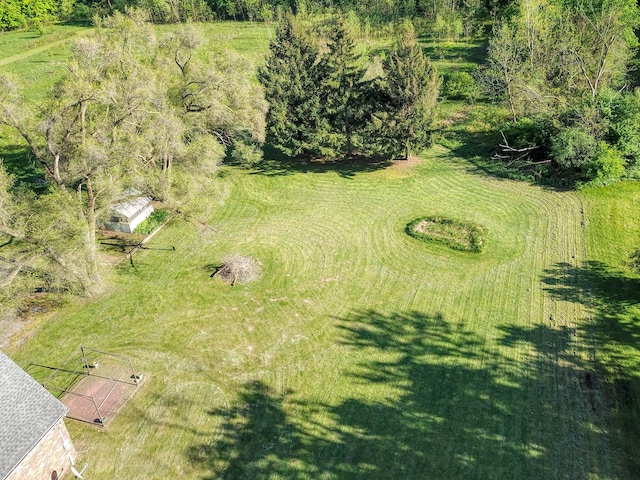 birds eye view of property with a rural view