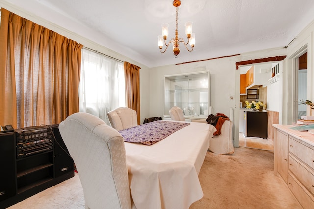 carpeted dining space with a chandelier