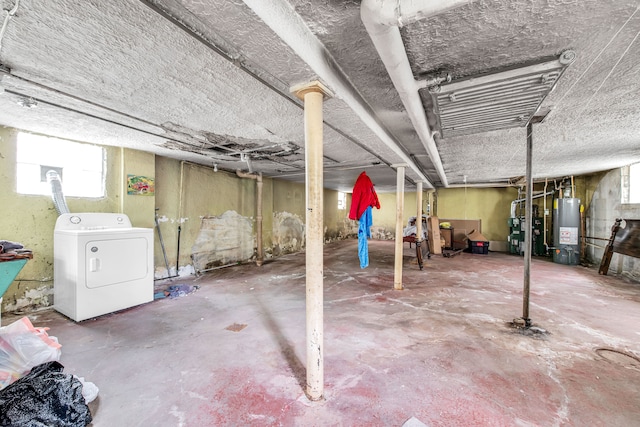 basement featuring washer / clothes dryer and water heater