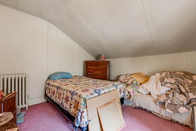 carpeted bedroom featuring lofted ceiling, radiator heating unit, and a textured ceiling