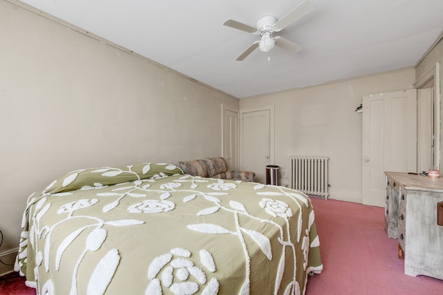 bedroom featuring radiator heating unit, carpet floors, and ceiling fan