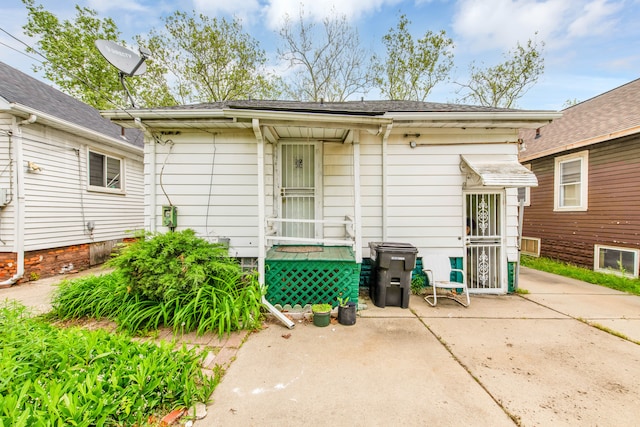 back of house with a patio