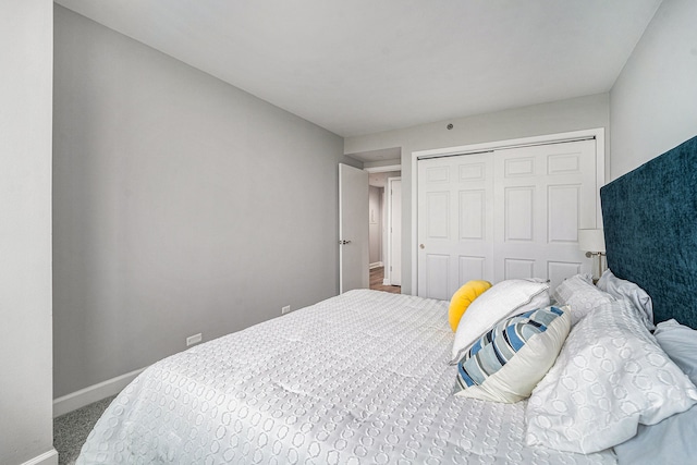 carpeted bedroom with a closet