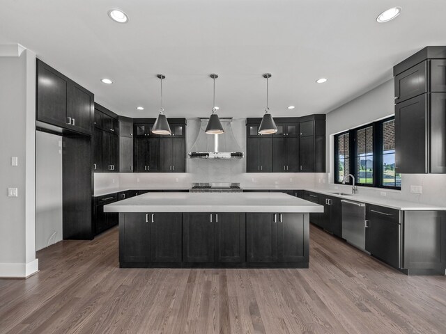 2605 Fairway, Rochester, MI 48306 - kitchen with wall chimney exhaust hood, dishwasher, a kitchen island, dark cabinetry, and recessed lighting