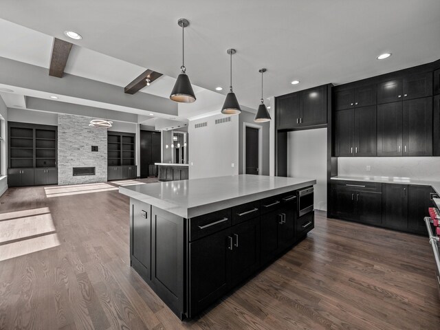 2605 Fairway, Rochester, MI 48306 - kitchen with dark cabinets, dark wood-style flooring, beamed ceiling, freestanding refrigerator, and recessed lighting
