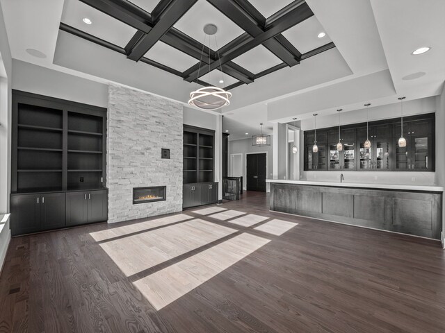 2605 Fairway, Rochester, MI 48306 - unfurnished living room with a chandelier, wood finished floors, a fireplace, built in shelves, and coffered ceiling