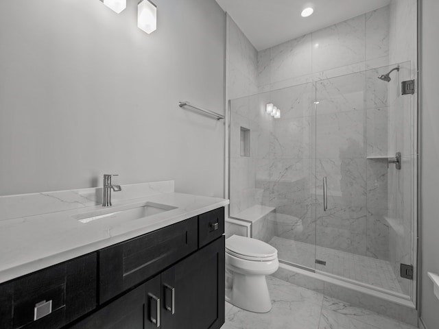 bathroom featuring vanity, toilet, and an enclosed shower