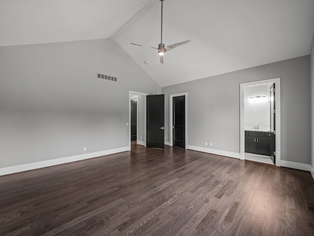 unfurnished bedroom featuring high vaulted ceiling, ceiling fan, dark hardwood / wood-style flooring, and connected bathroom