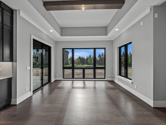 empty room with beamed ceiling and dark hardwood / wood-style floors