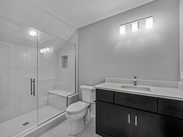 bathroom featuring tile patterned floors, walk in shower, vanity, vaulted ceiling, and toilet