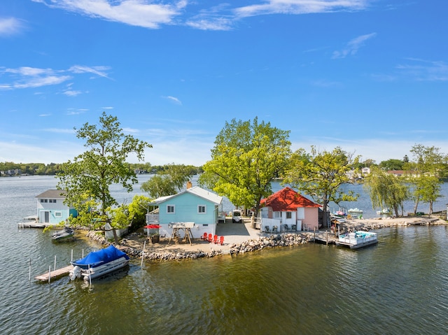 view of dock featuring a water view and a patio