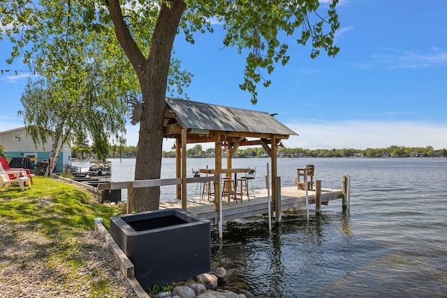 dock area with a water view