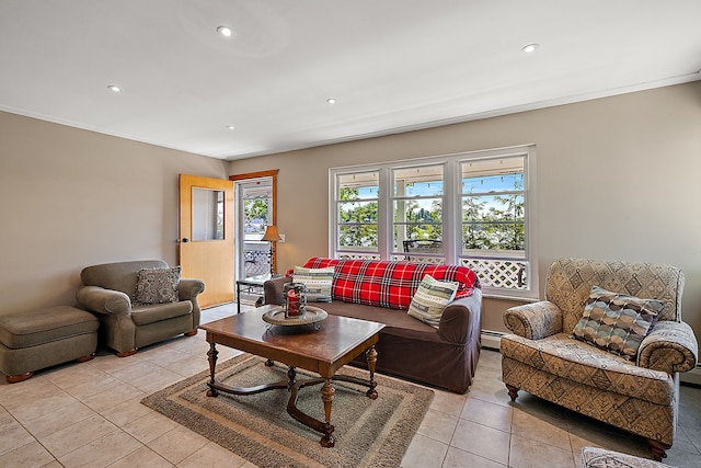 living room with light tile patterned floors, crown molding, and a baseboard heating unit