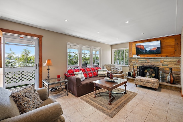 living room with a fireplace, light tile patterned flooring, and french doors