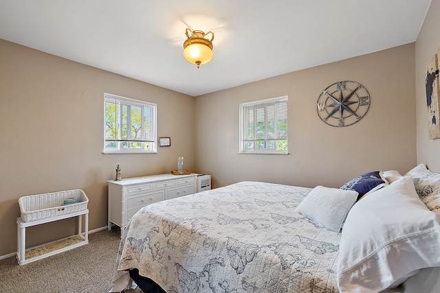 carpeted bedroom with multiple windows