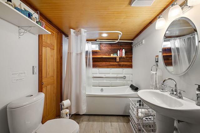 full bathroom featuring shower / bath combo, hardwood / wood-style flooring, toilet, and wooden ceiling